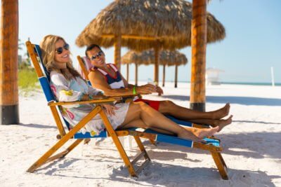 guests lounge on the beach while on vacation in Fort Myers