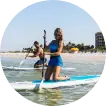 guests enjoy complimentary SUP rentals in Fort Myers Beach